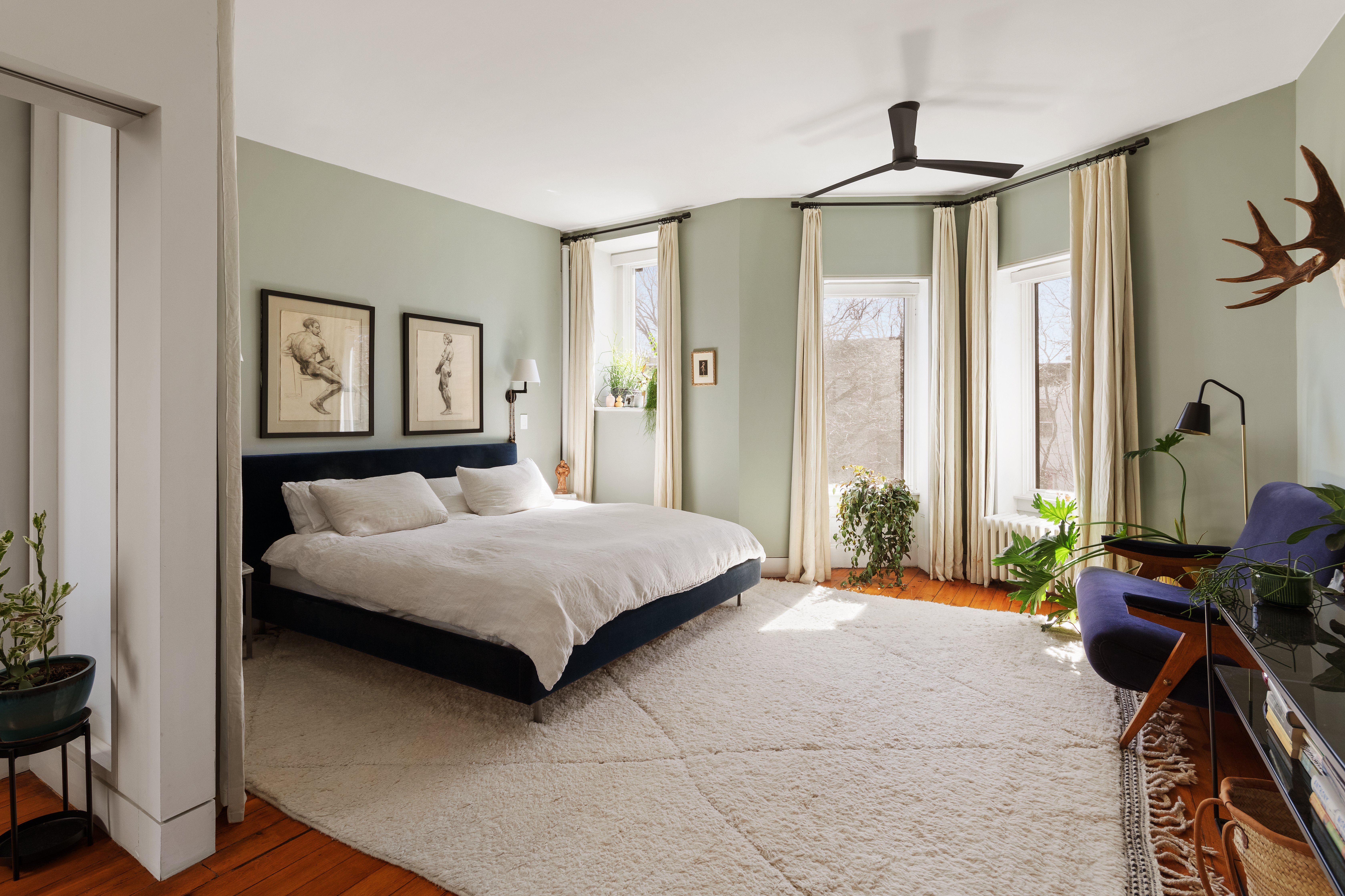 171 Garfield Place Brooklyn, NY 11215 - Photo 4 of 19 a bedroom with a bed mirror and window