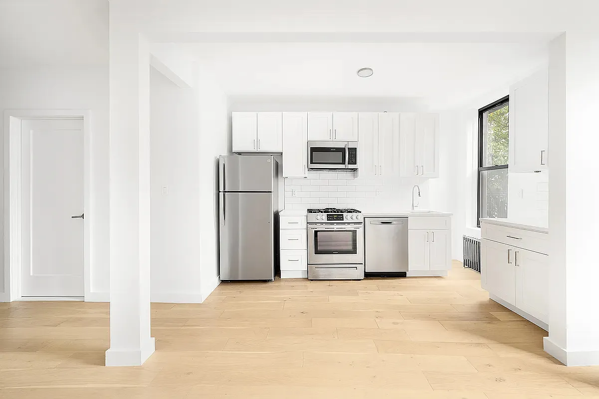 82 Clinton Avenue, Unit 4 Brooklyn, NY 11205 - Photo 2 of 11 a kitchen with stainless steel appliances a refrigerator and a stove top oven