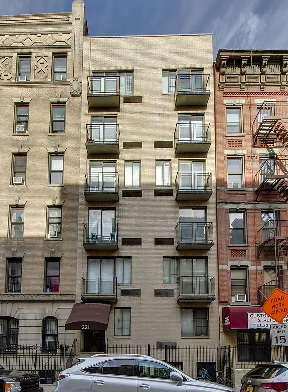 221 East 82nd Street, Unit 6A Manhattan, NY 10028 - Photo 10 of 11 a front view of a building with glass windows