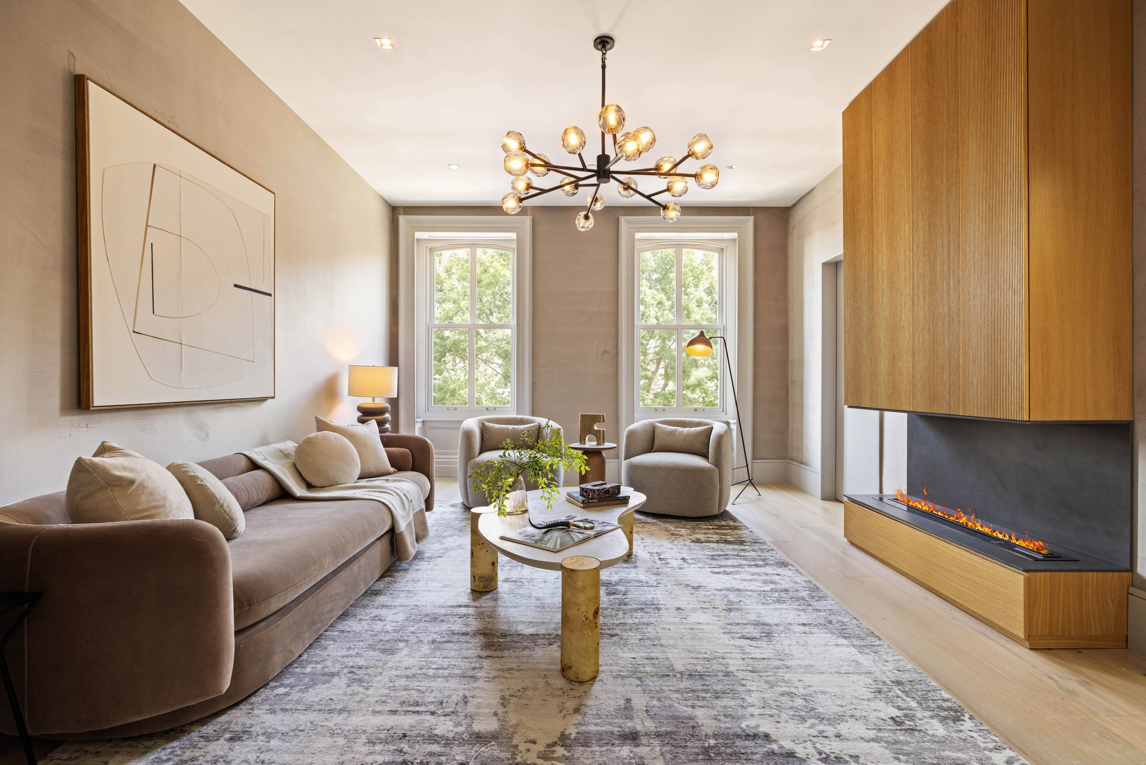 197 Clinton Street Brooklyn, NY 11201 - Photo 13 of 24 a living room with patio furniture and a chandelier