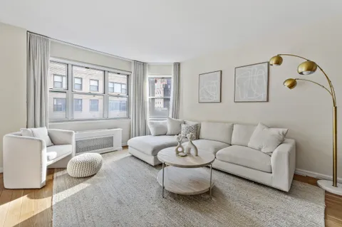 a living room with furniture and window