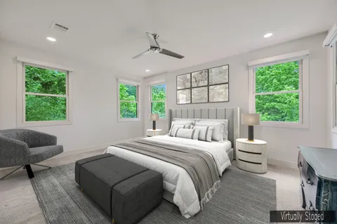 a bedroom with a bed and a couch