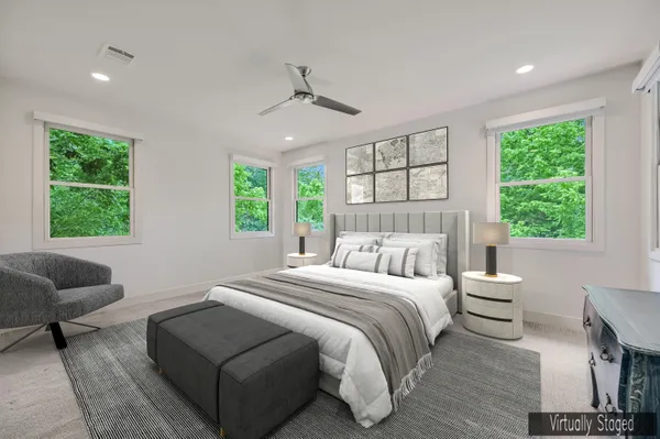 a bedroom with a bed and a couch