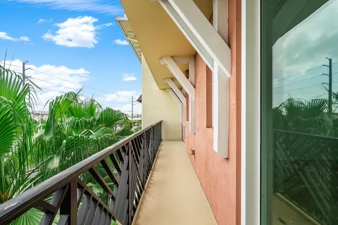a view of a balcony with wooden floor