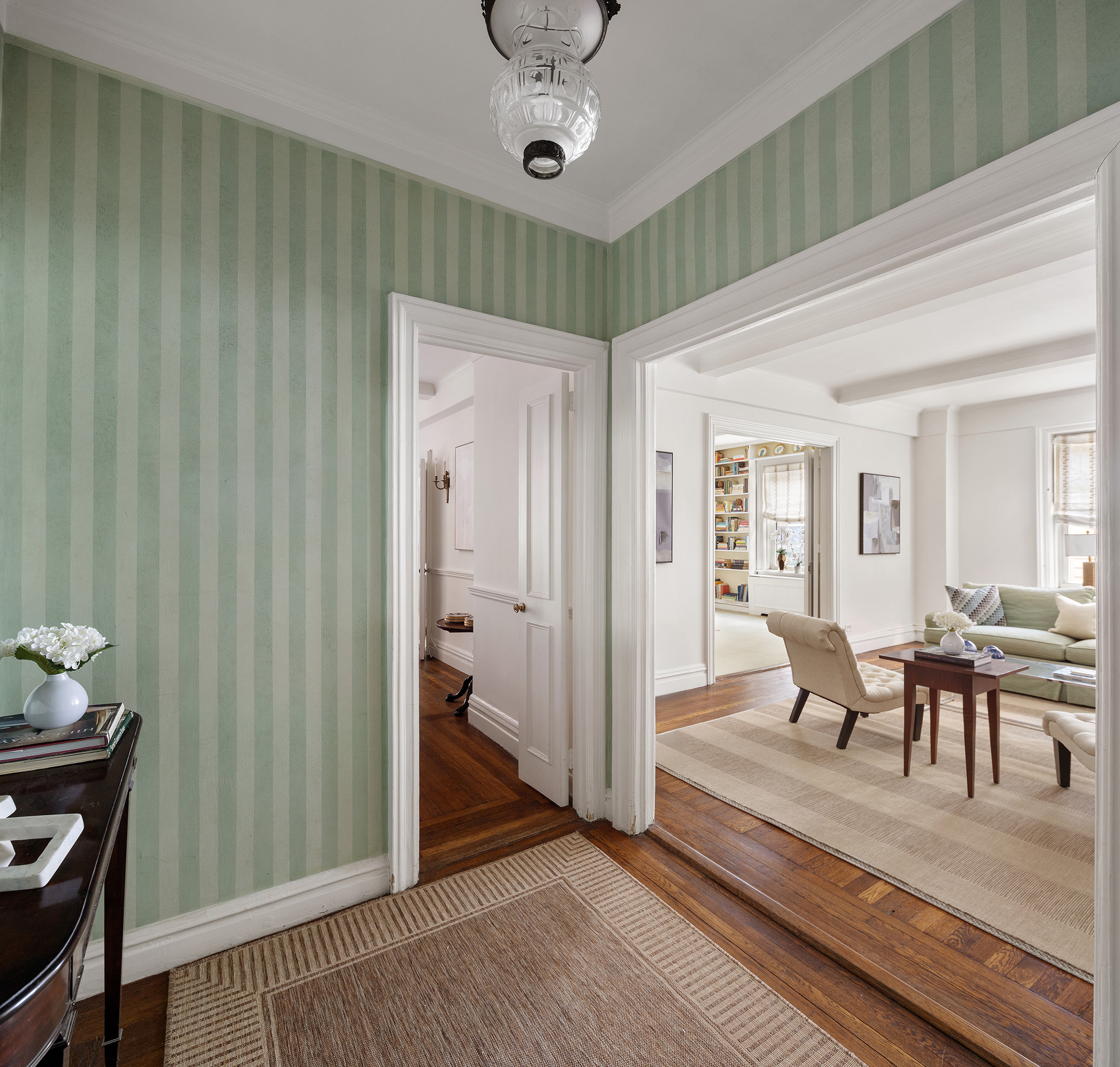 125 East 63rd Street, Unit 2B Manhattan, NY 10065 - Photo 3 of 12 a view of a livingroom with furniture and hardwood floor