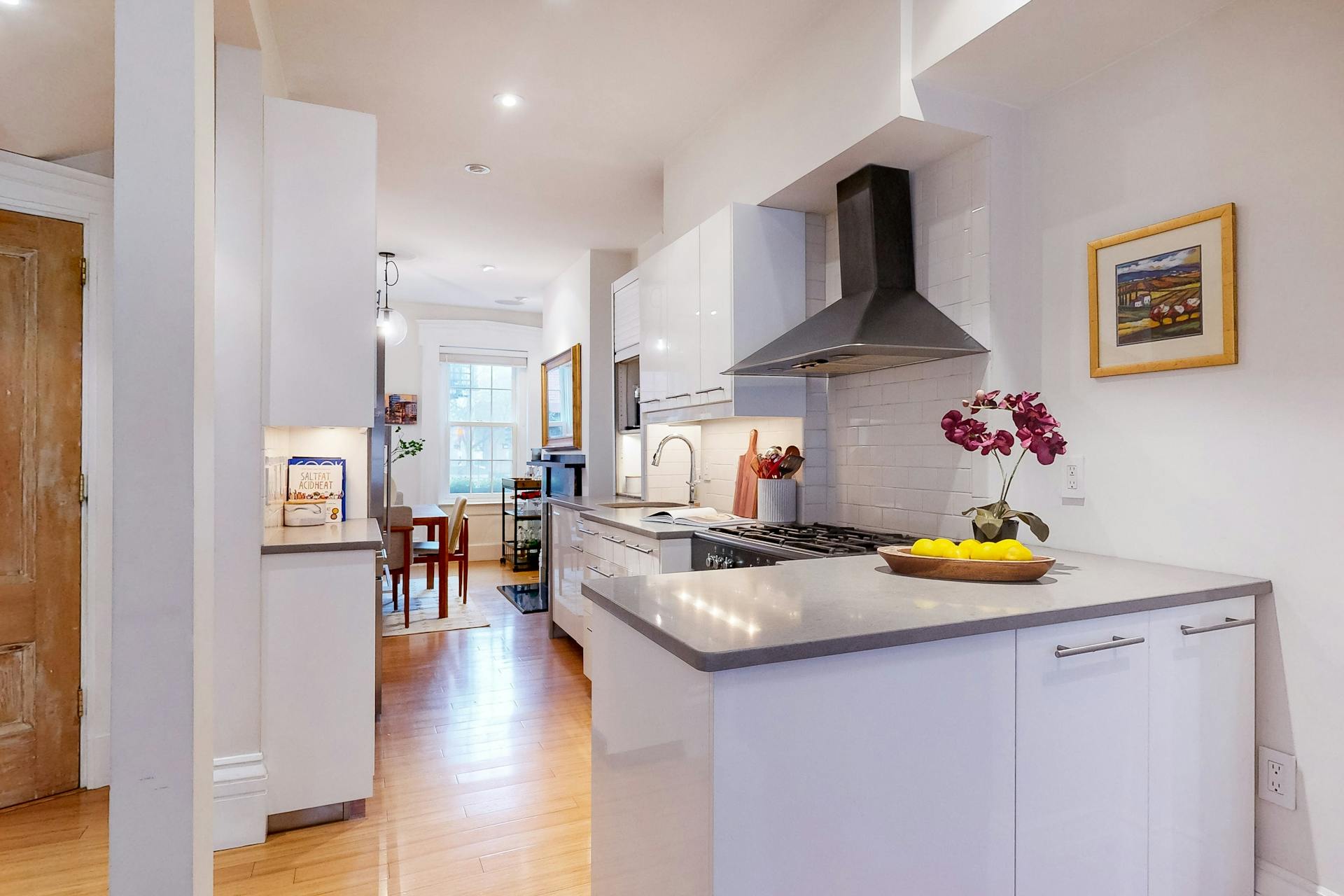 11 Fayette Street, Unit 1 Boston, MA 02116 - Photo 8 of 33 a kitchen with a sink cabinets and counter space