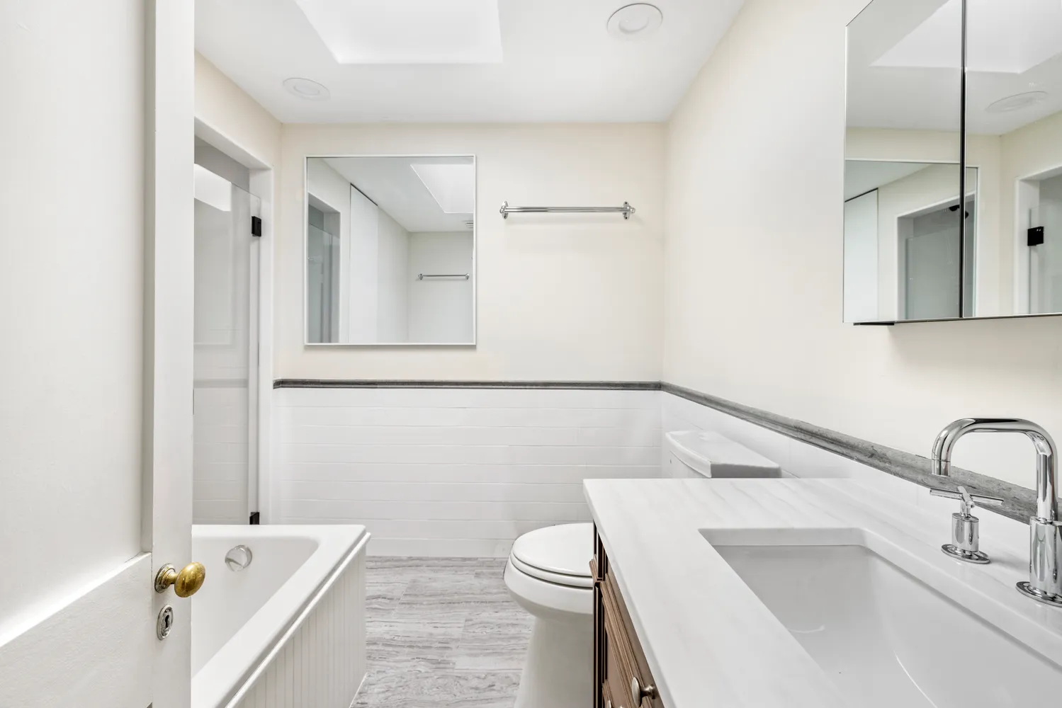 a bathroom with a sink a toilet and a bathtub