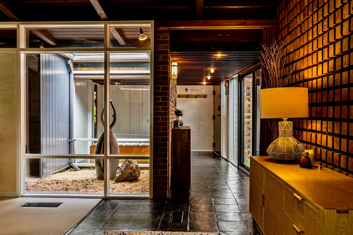 a living room with patio furniture and a window