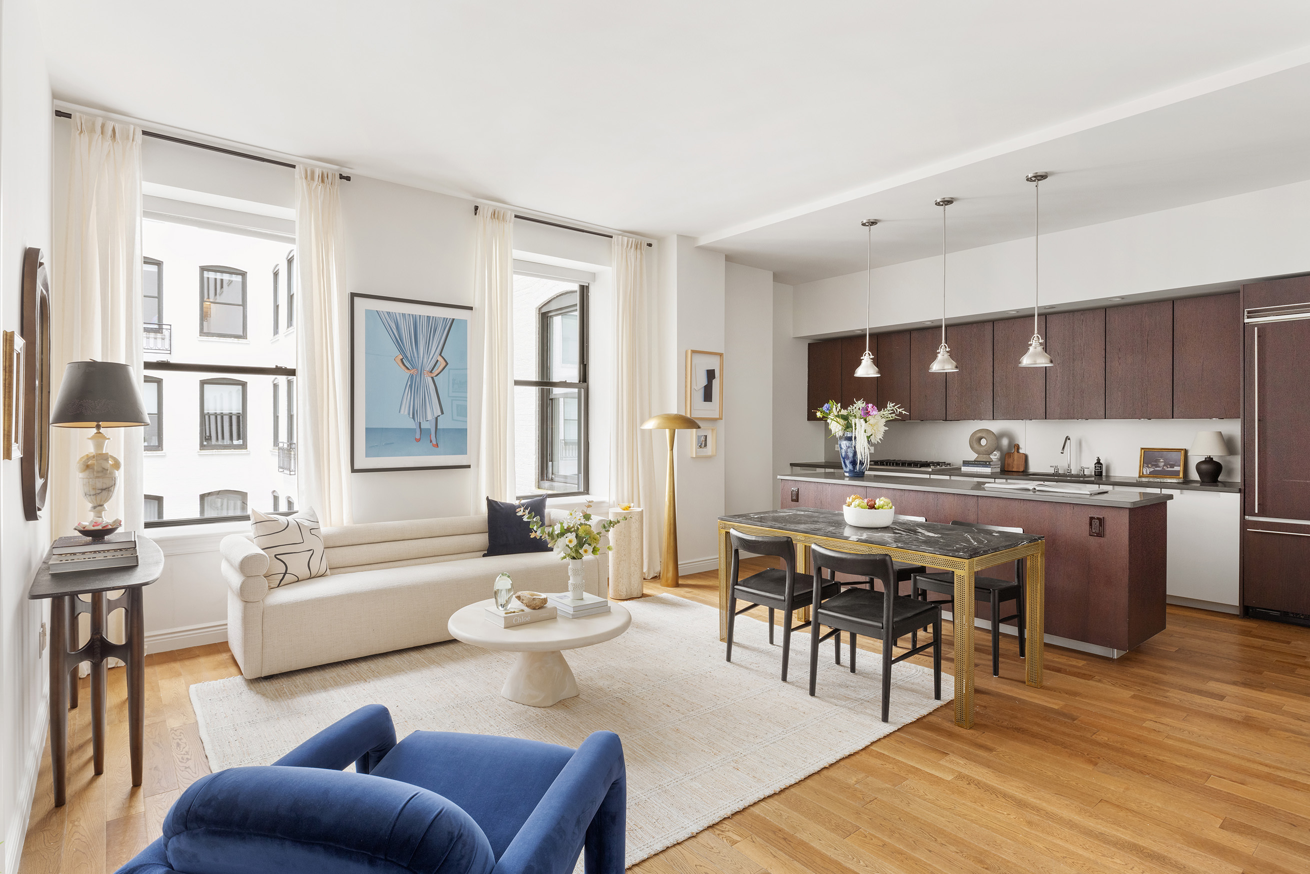 225 5th Avenue, Unit 6T Manhattan, NY 10010 - Photo 3 of 12 a living room with stainless steel appliances kitchen island granite countertop furniture and a kitchen view