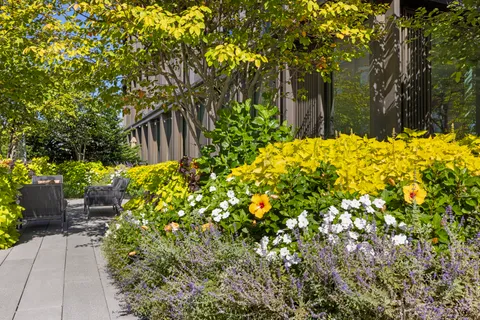a view of yellow house with a yard