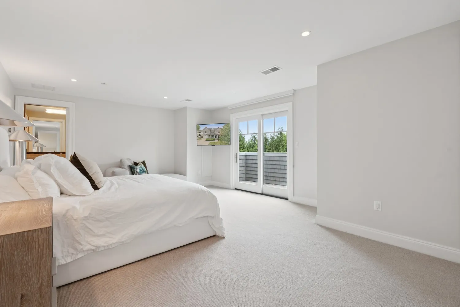 a bedroom with a bed and a couch