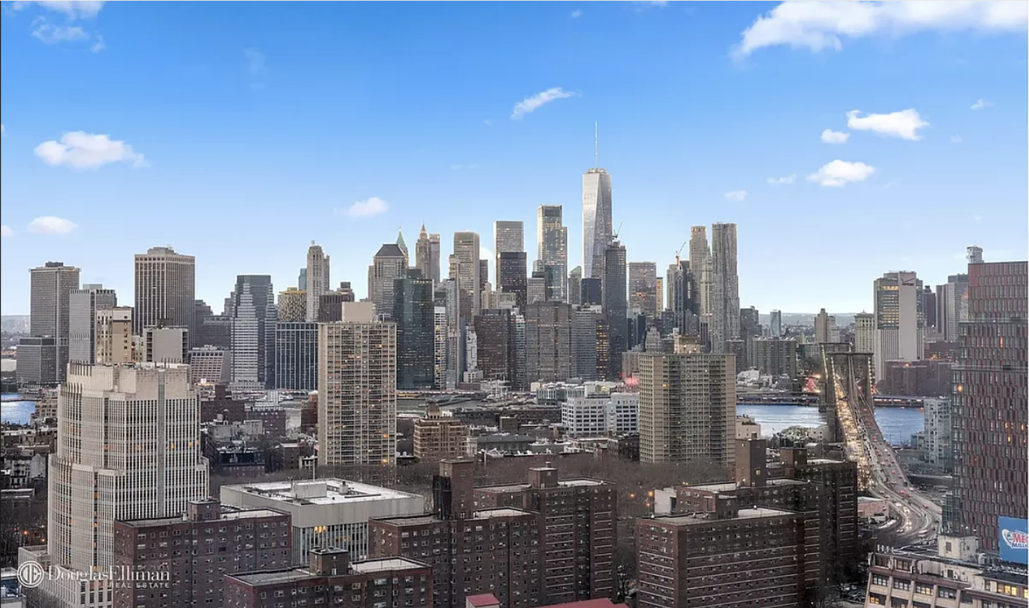 a view of a city with tall buildings