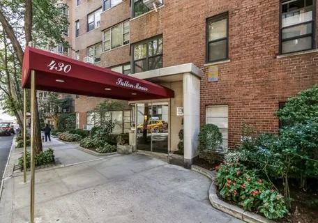 a view of a building with sitting area