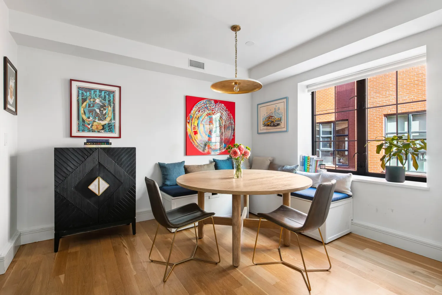 a view of a dining room with furniture window and wooden floor