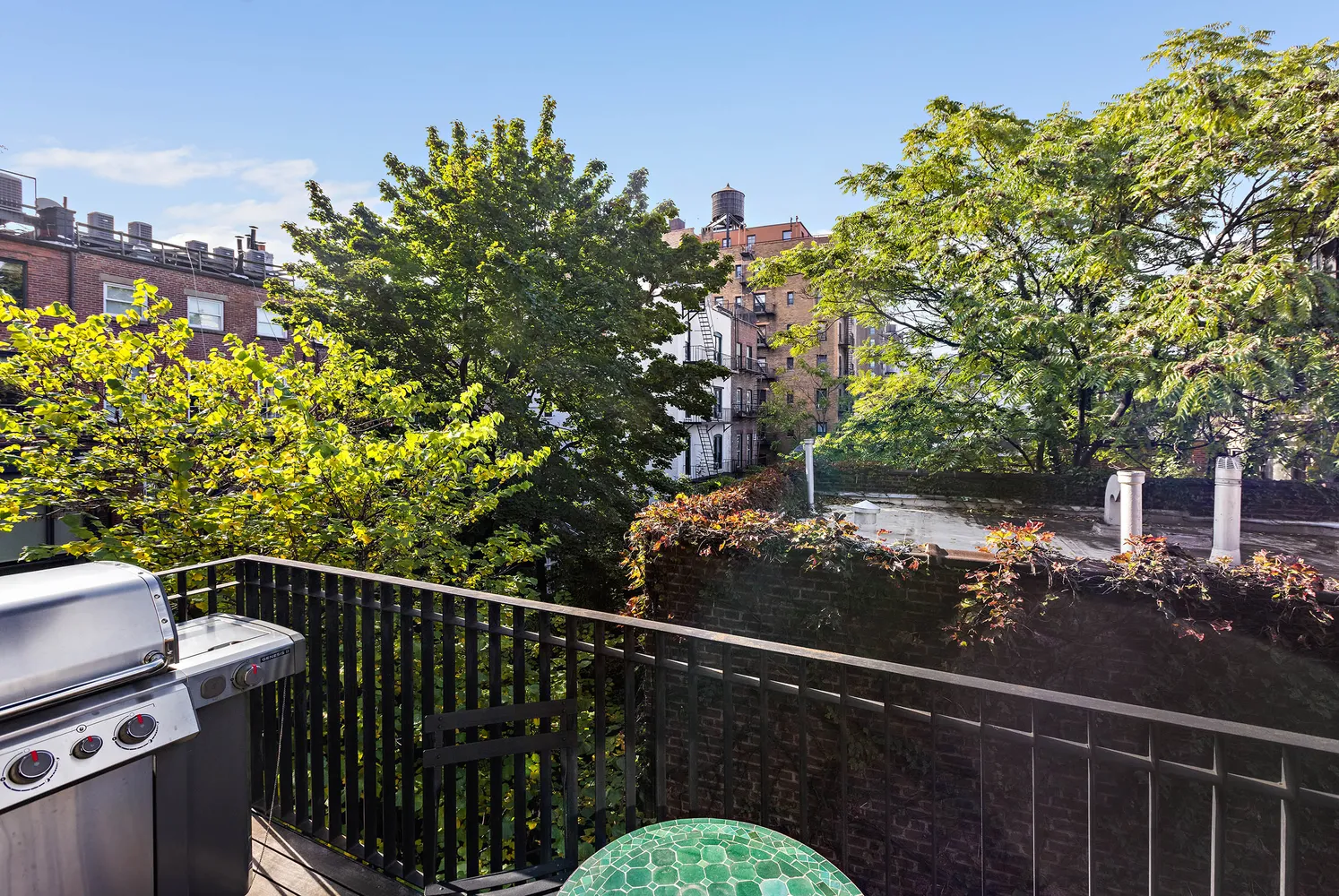 a view of a balcony with wooden fence