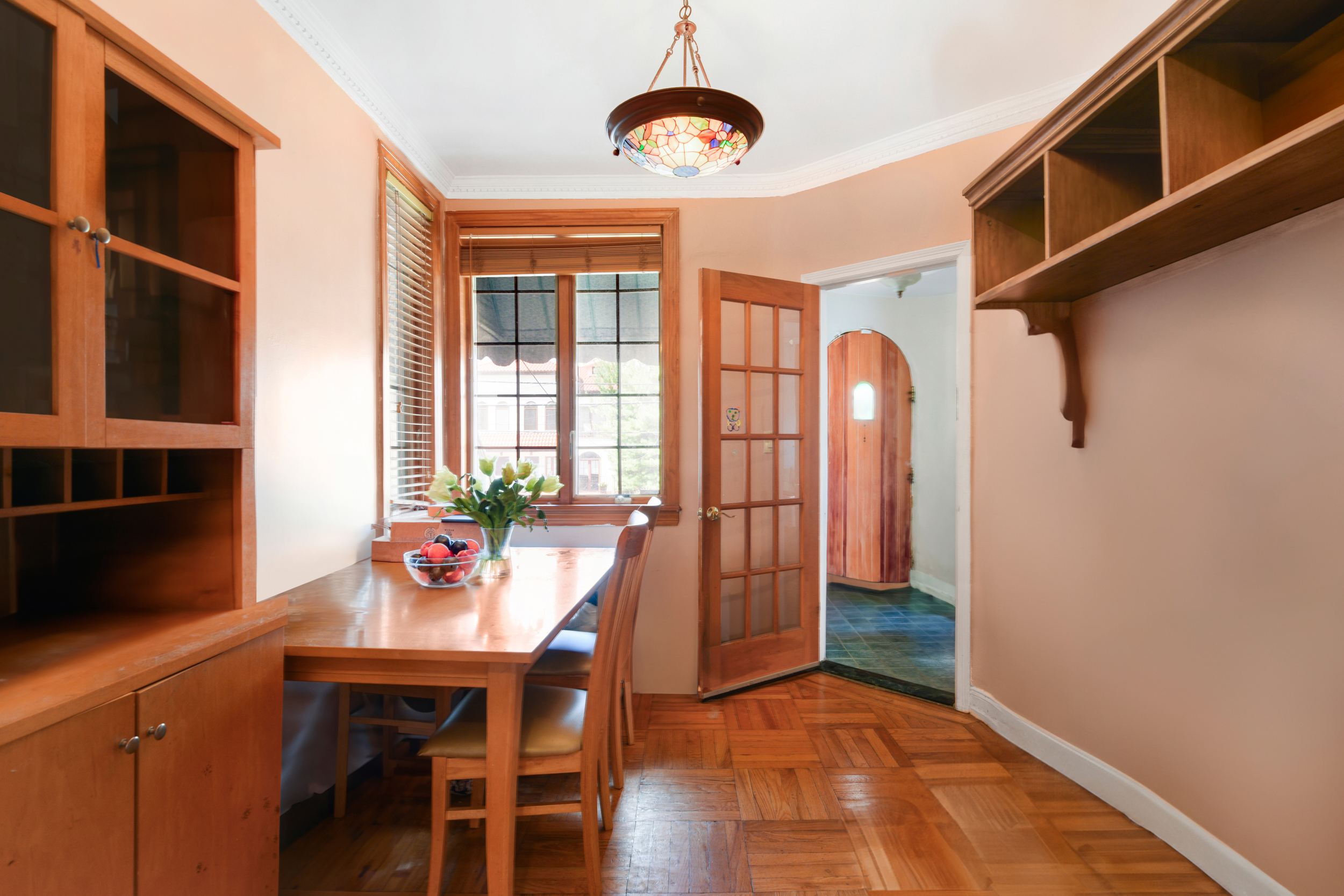 233 Battery Avenue Brooklyn, NY 11209 - Photo 4 of 17 a view of a dining room with furniture and wooden floor