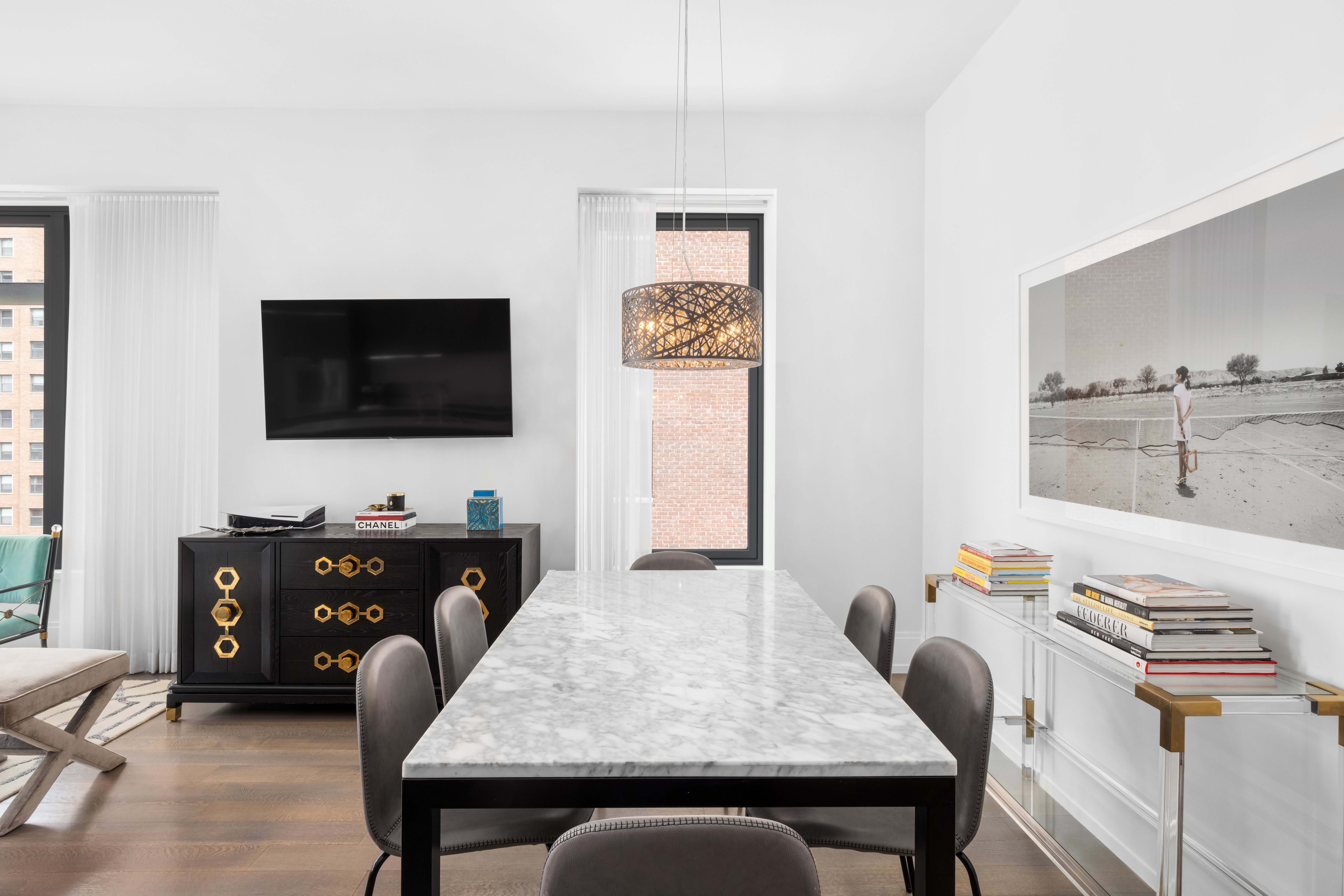 301 East 50th Street, Unit 8C Manhattan, NY 10022 - Photo 2 of 20 a living room with furniture and a flat screen tv
