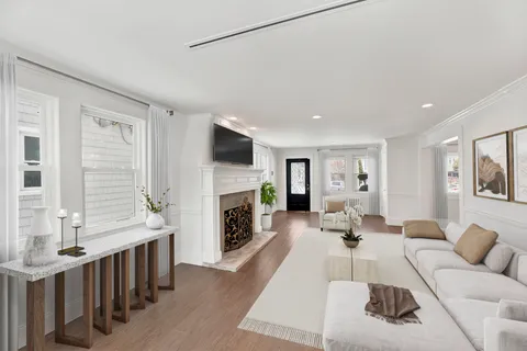a living room with furniture fireplace and flat screen tv
