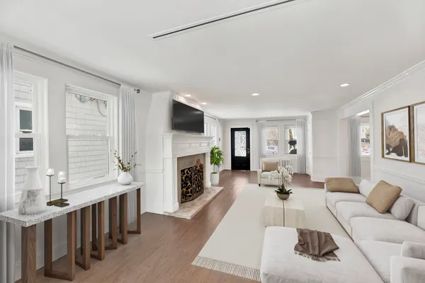a living room with furniture fireplace and flat screen tv