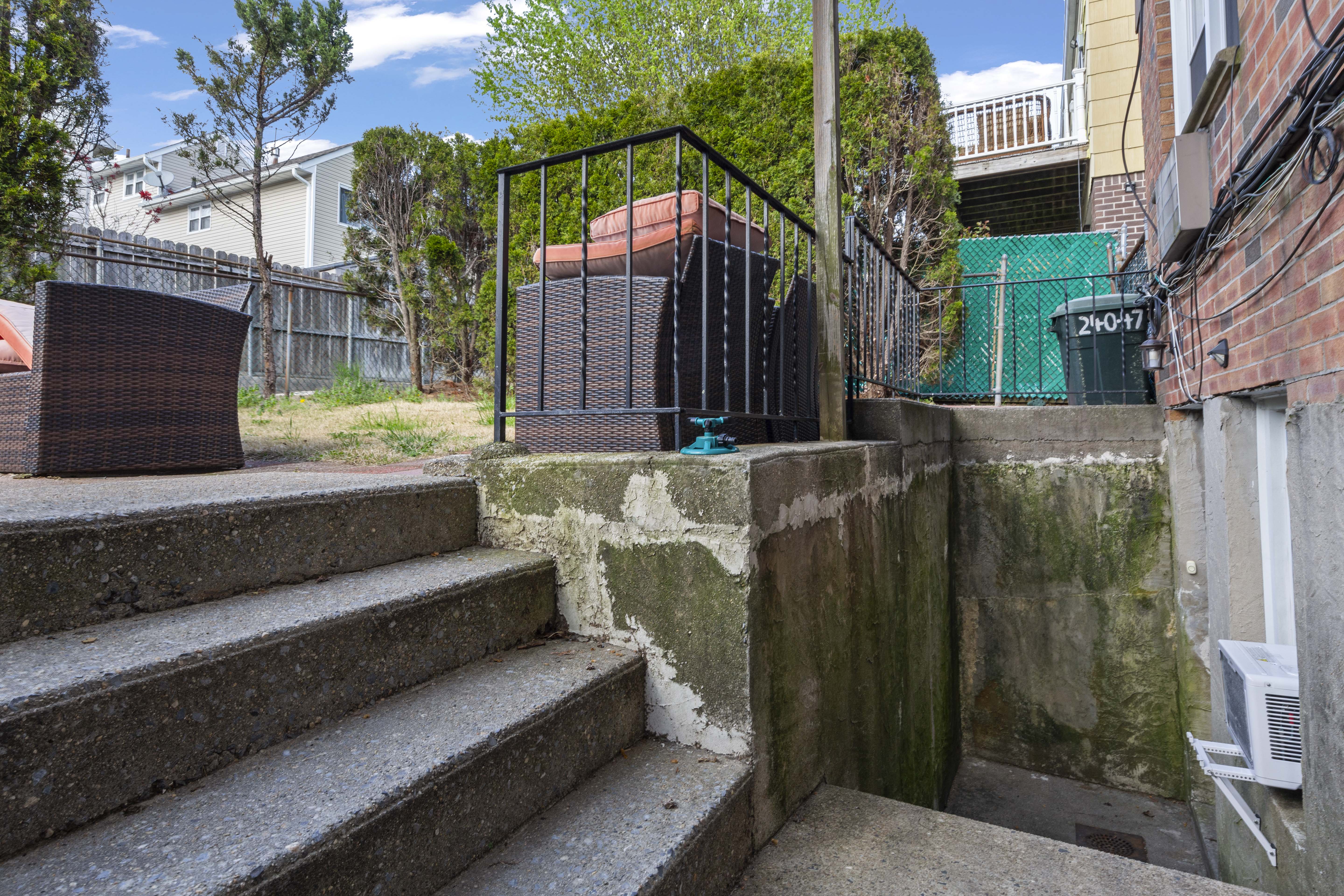 240-47 68th Avenue Queens, NY 11362 - Photo 35 of 39 a view of a house with a bed and wooden floor