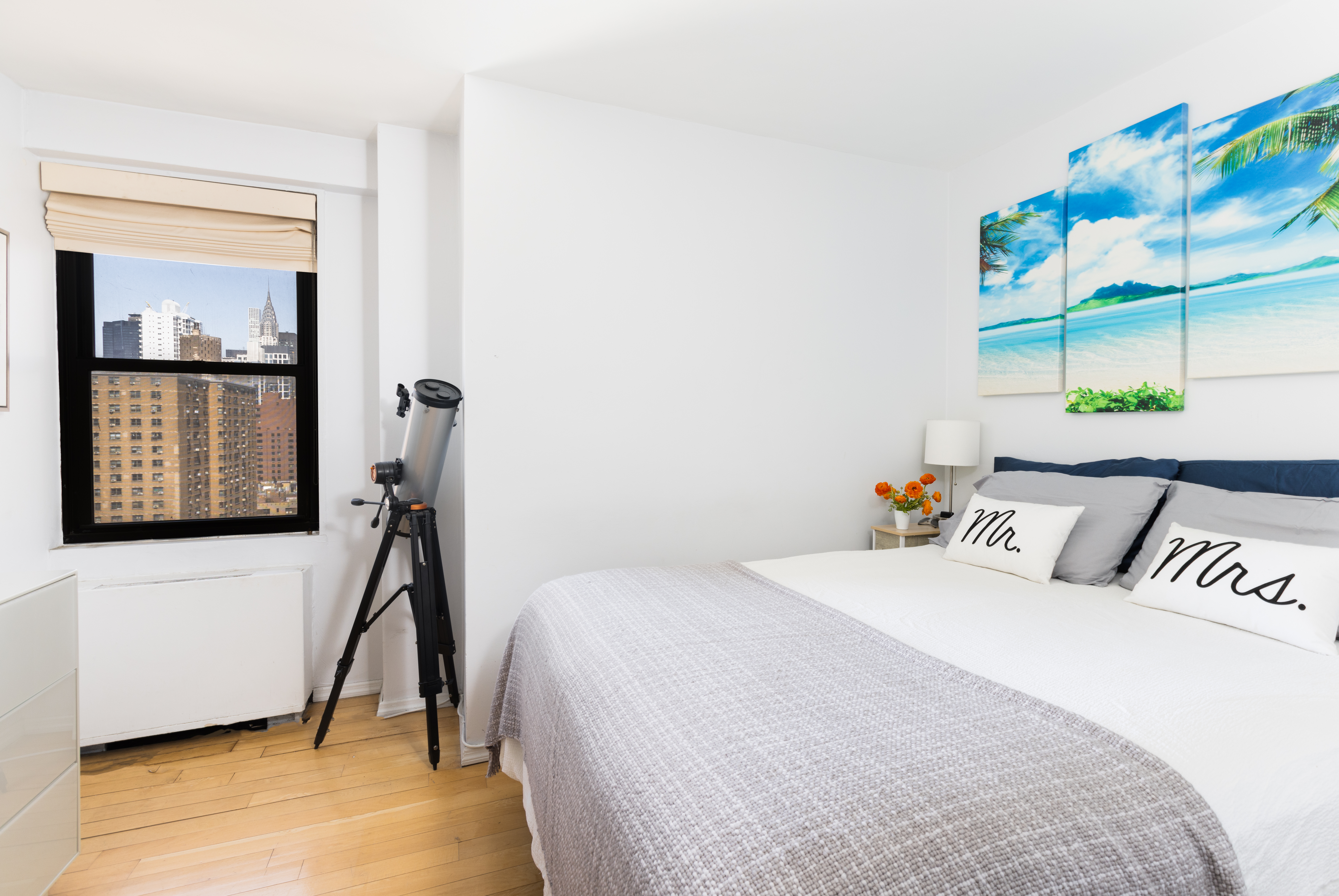 245 East 25th Street, Unit 19L Manhattan, NY 10010 - Photo 7 of 13 a bed room with a bed and a window