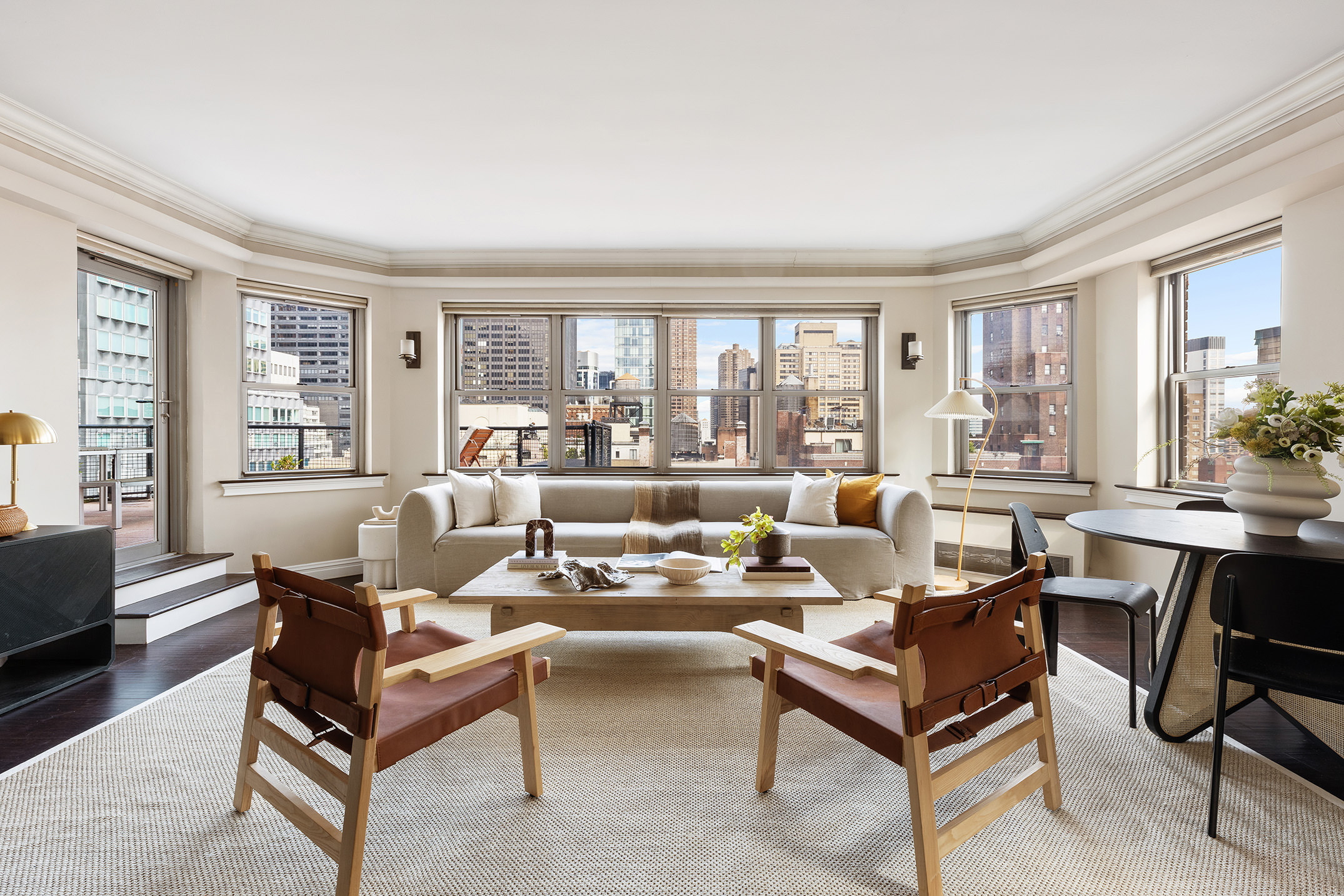 80 Park Avenue, Unit 19N Manhattan, NY 10016 - Photo 6 of 20 a living room with furniture and a large window