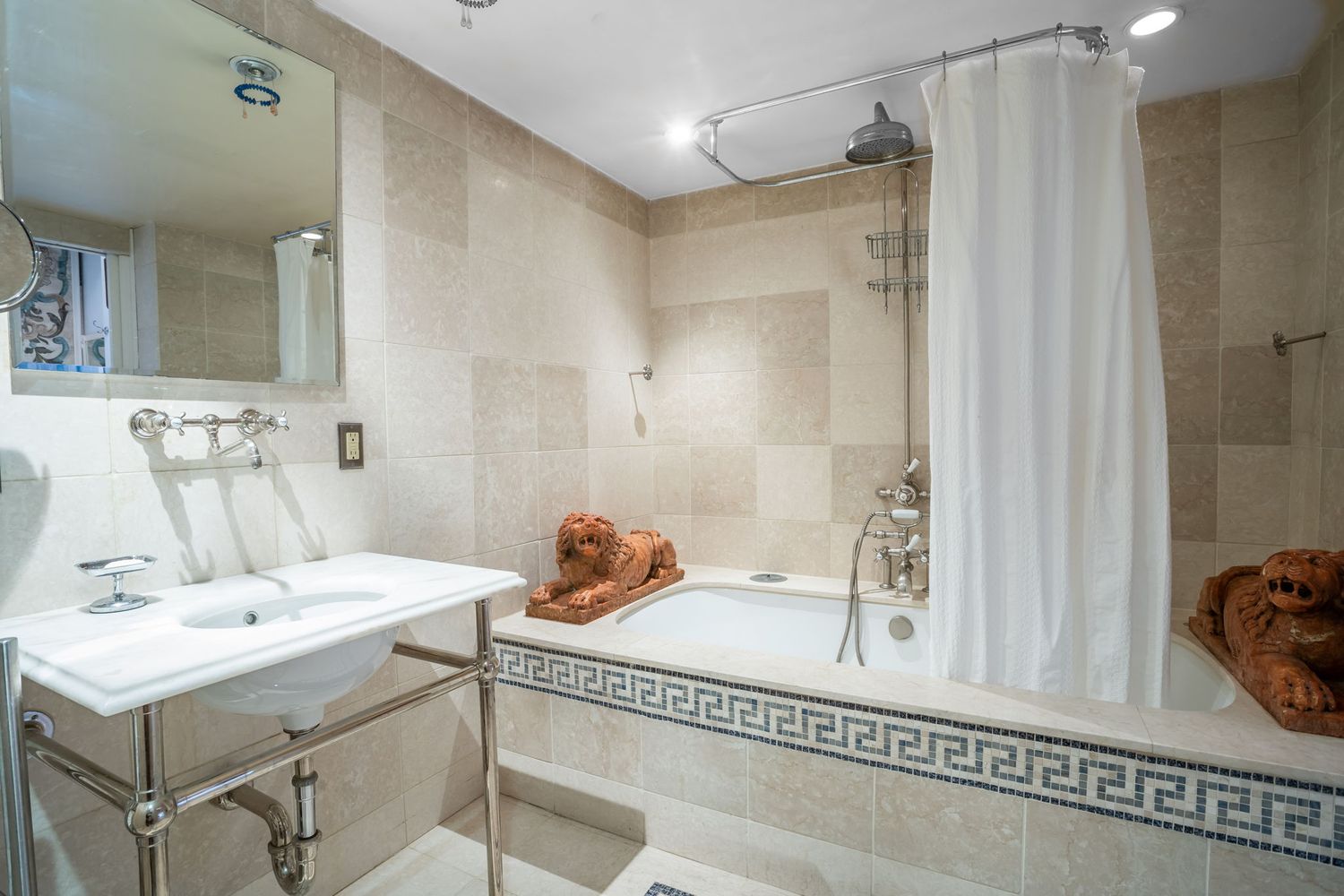 240 Centre Street, Unit 3B Manhattan, NY 10013 - Photo 10 of 23 a bathroom with a sink and a mirror