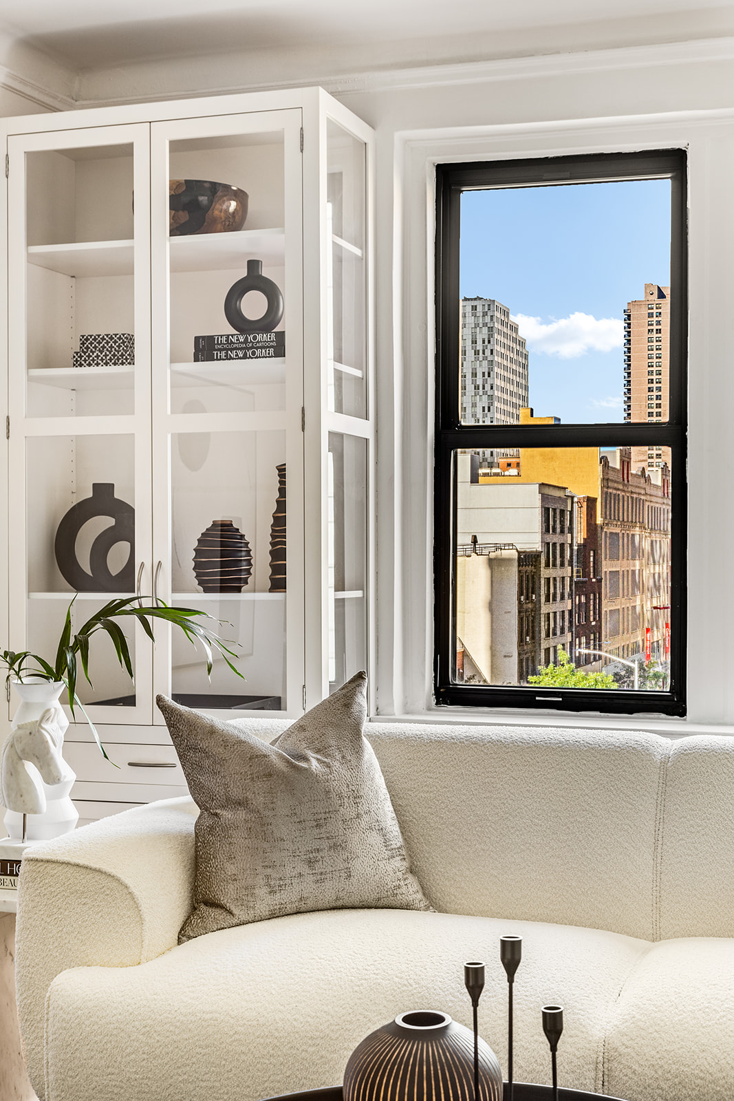 357 West 55th Street, Unit 4D Manhattan, NY 10019 - Photo 2 of 11 a living room with furniture and a window