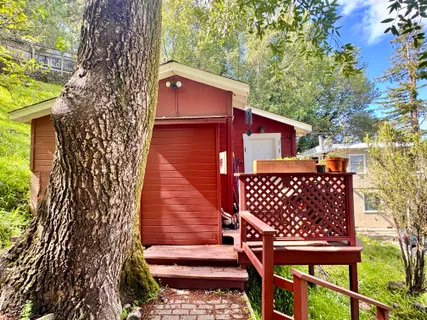 a view of a wooden door with a bench