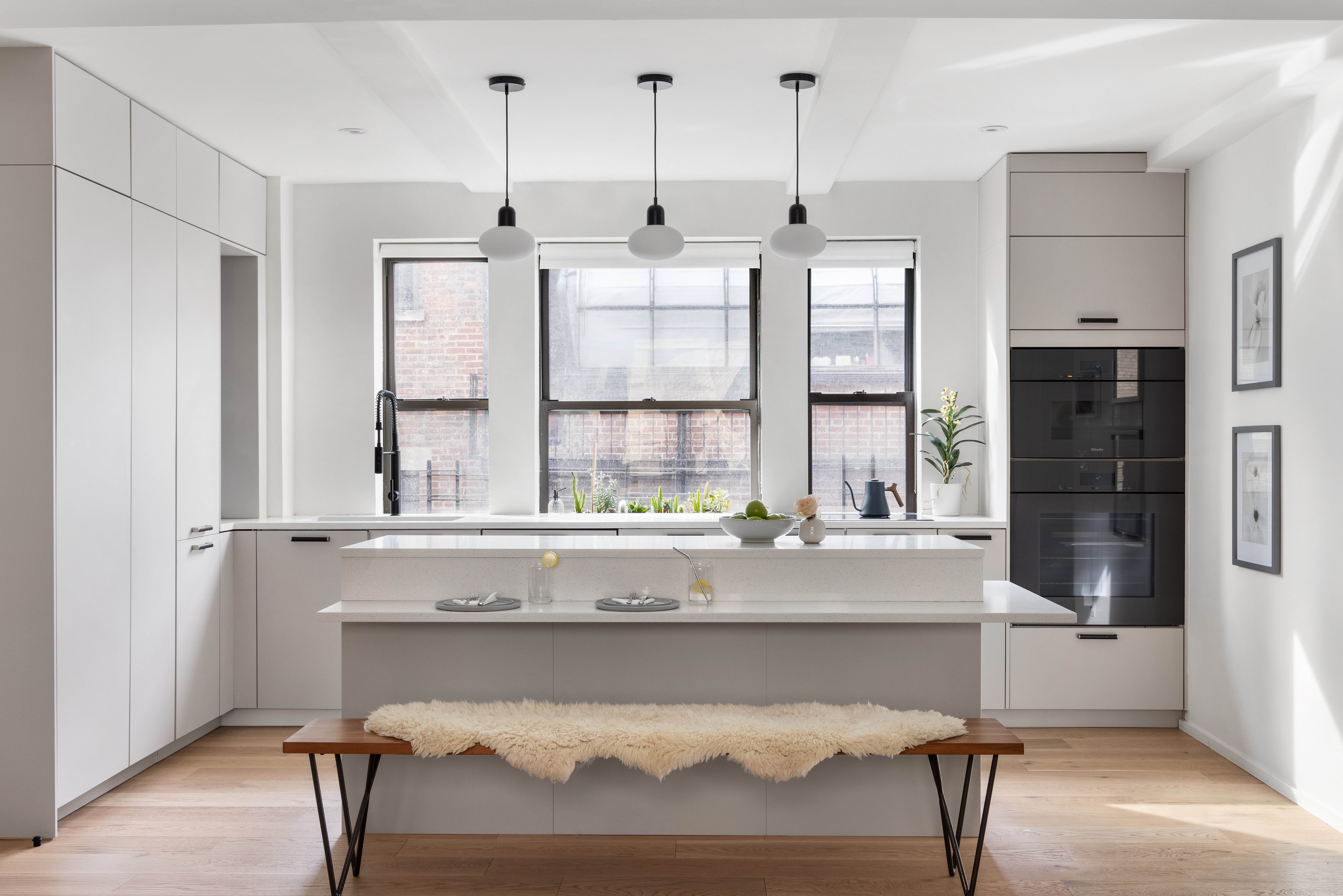 45 5th Avenue, Unit 15CD Manhattan, NY 10003 - Photo 4 of 14 a living room with a table chairs and refrigerator