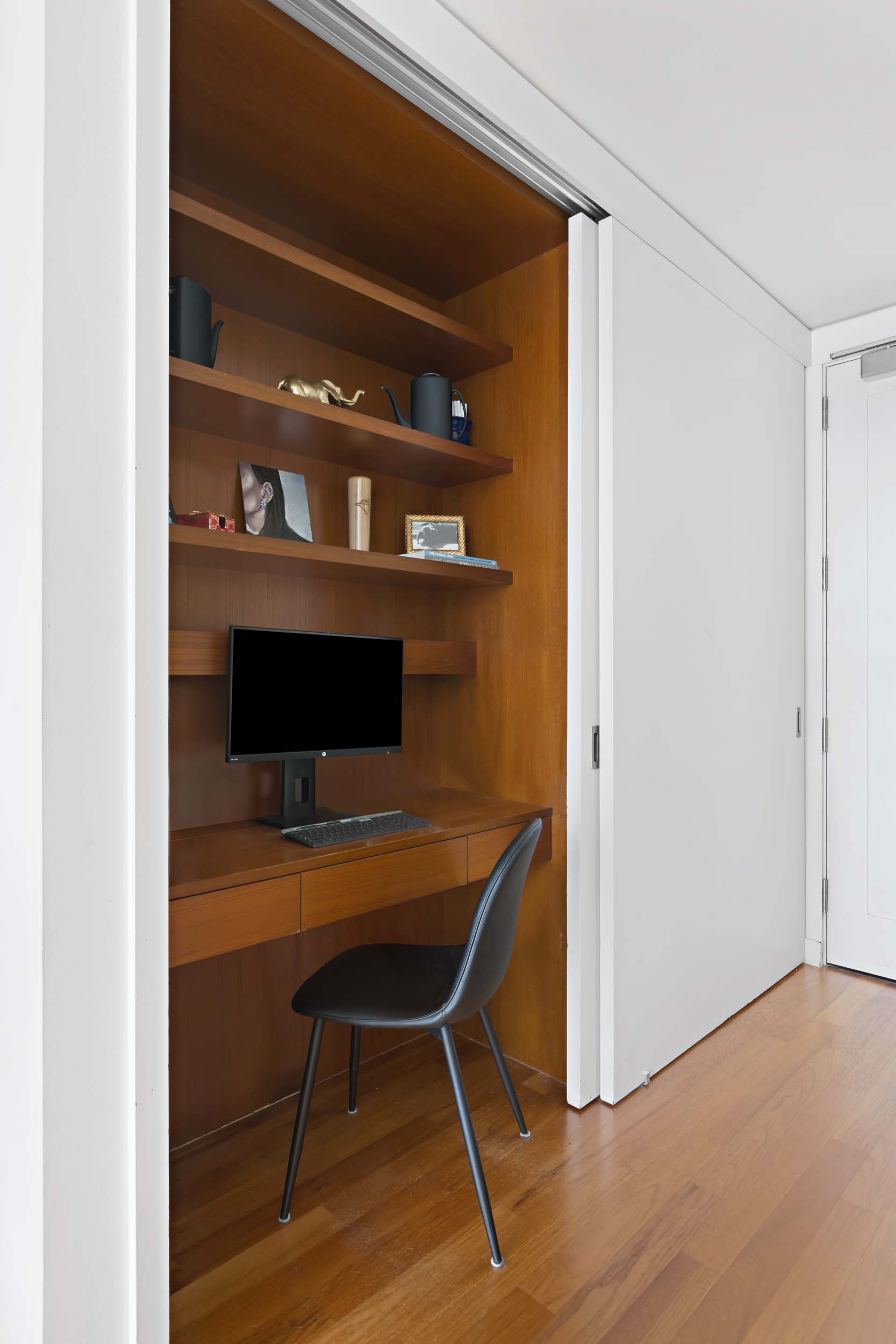 15 William Street, Unit 40C Manhattan, NY 10005 - Photo 4 of 18 a workspace with furniture and wooden floor