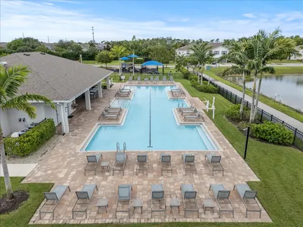 a view of a dining room with furniture and a livingroom