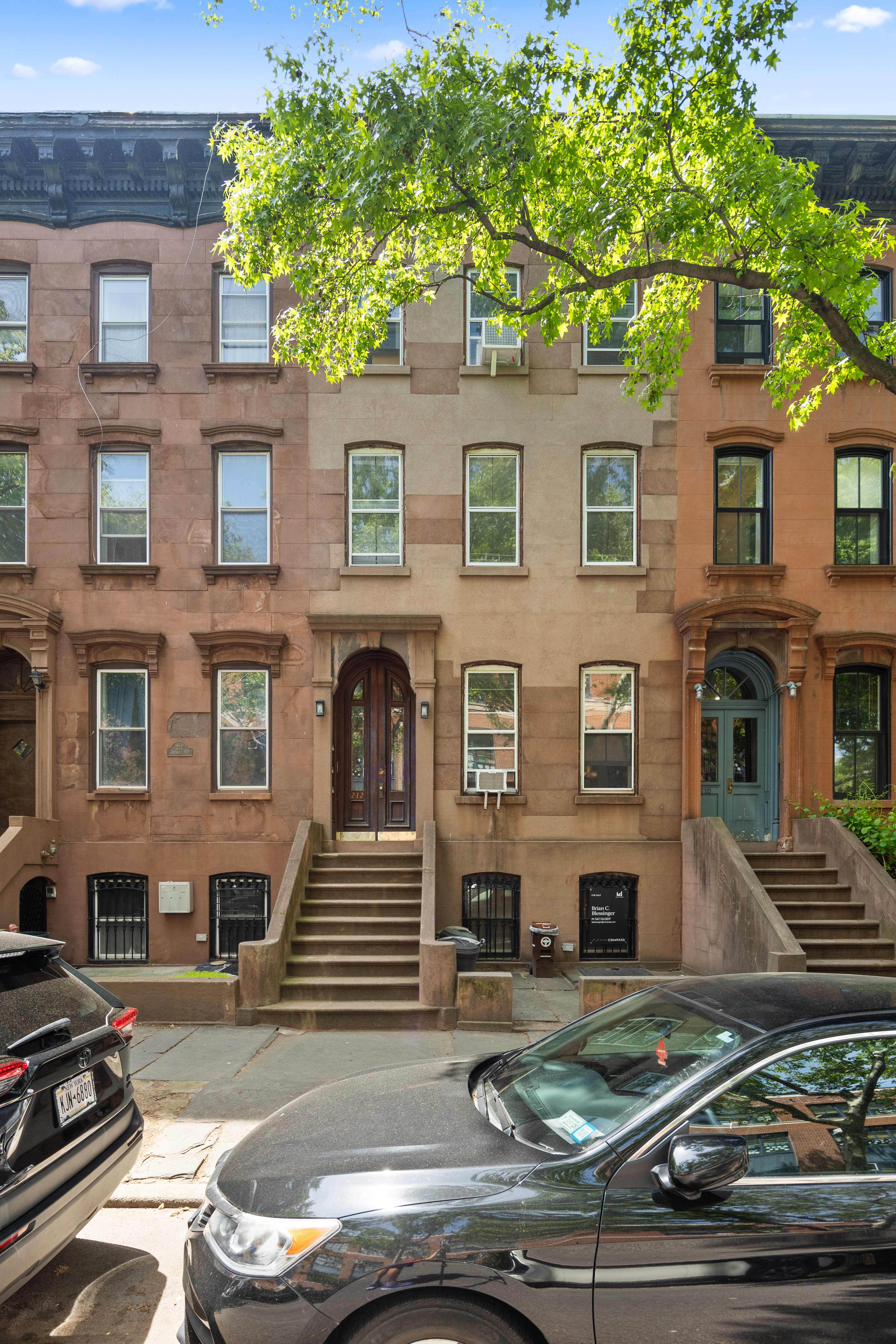 212 Adelphi Street Brooklyn, NY 11205 - Photo 1 of 11 a view of a brick house with many windows and yard