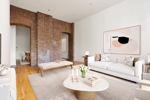 a living room with furniture and a lamp