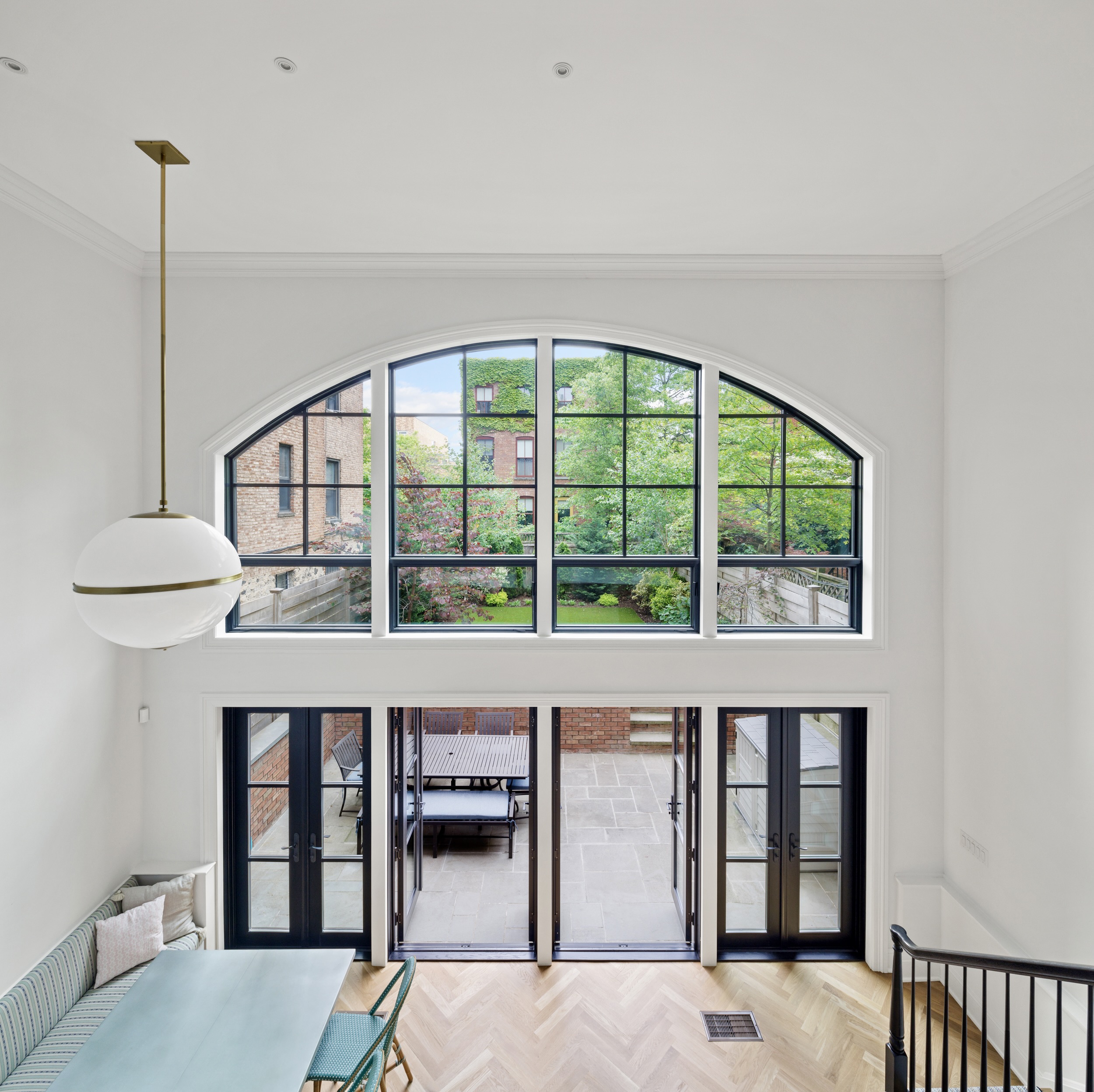 435 Clinton Avenue Brooklyn, NY 11238 - Photo 4 of 27 a living room with furniture and a large window