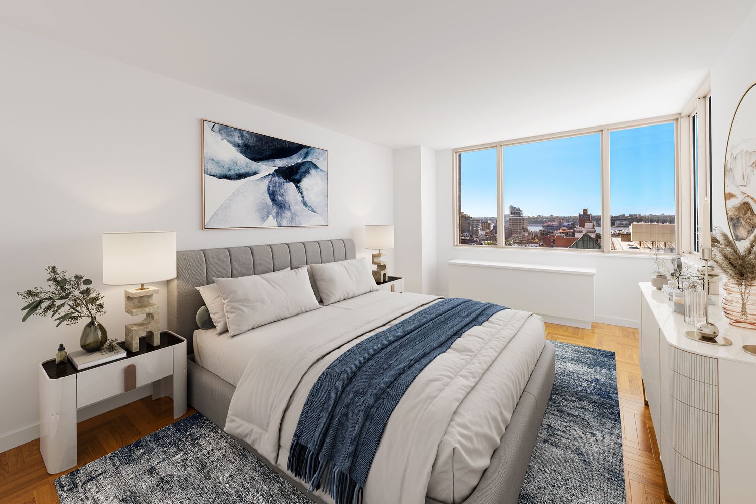 350 West 50th Street, Unit 15F Manhattan, NY 10019 - Photo 3 of 8 a bedroom with a bed and a couch