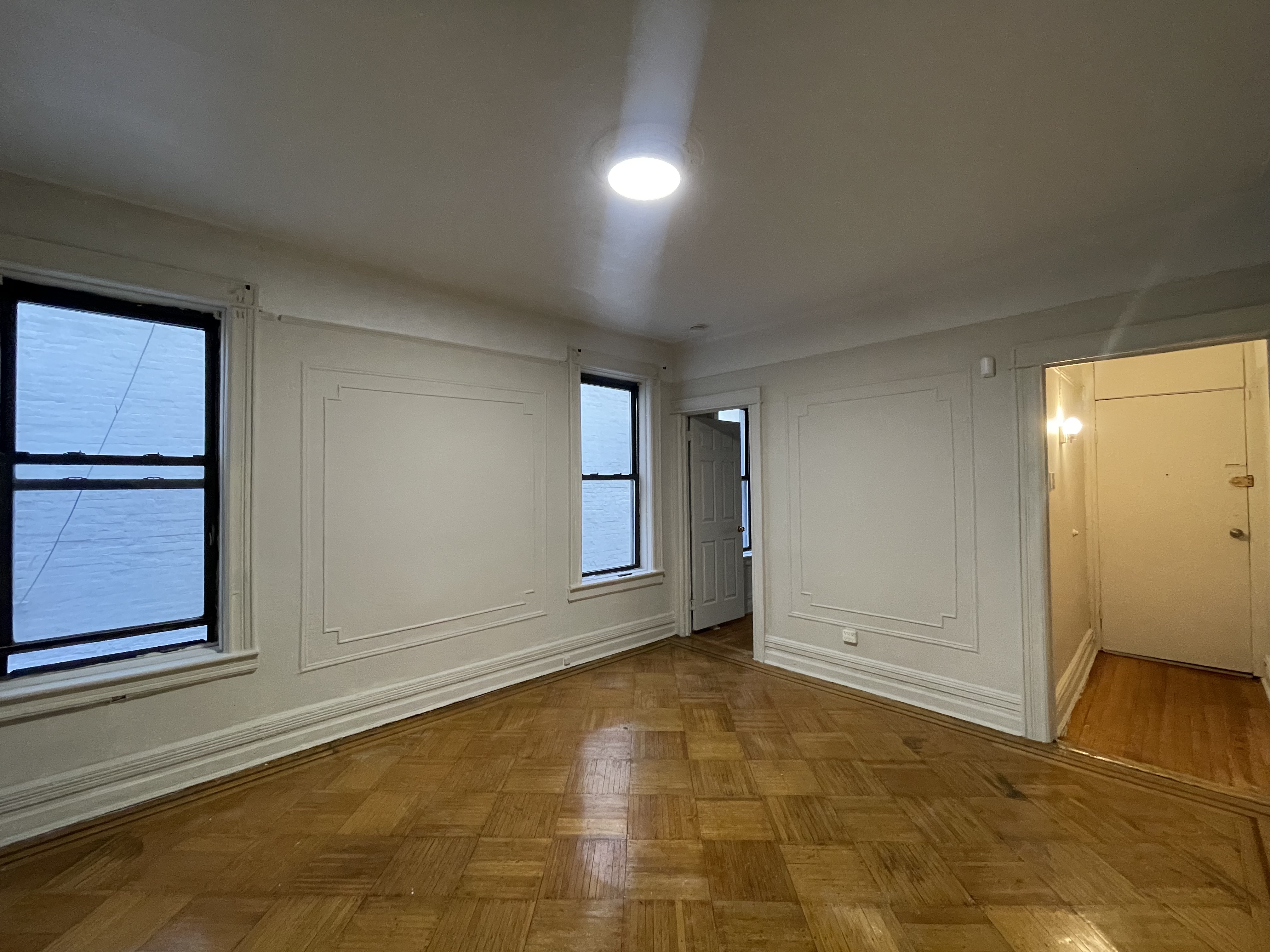 68-43 Fresh Pond Road, Unit 4L Queens, NY 11385 - Photo 3 of 5 a view of an empty room and window