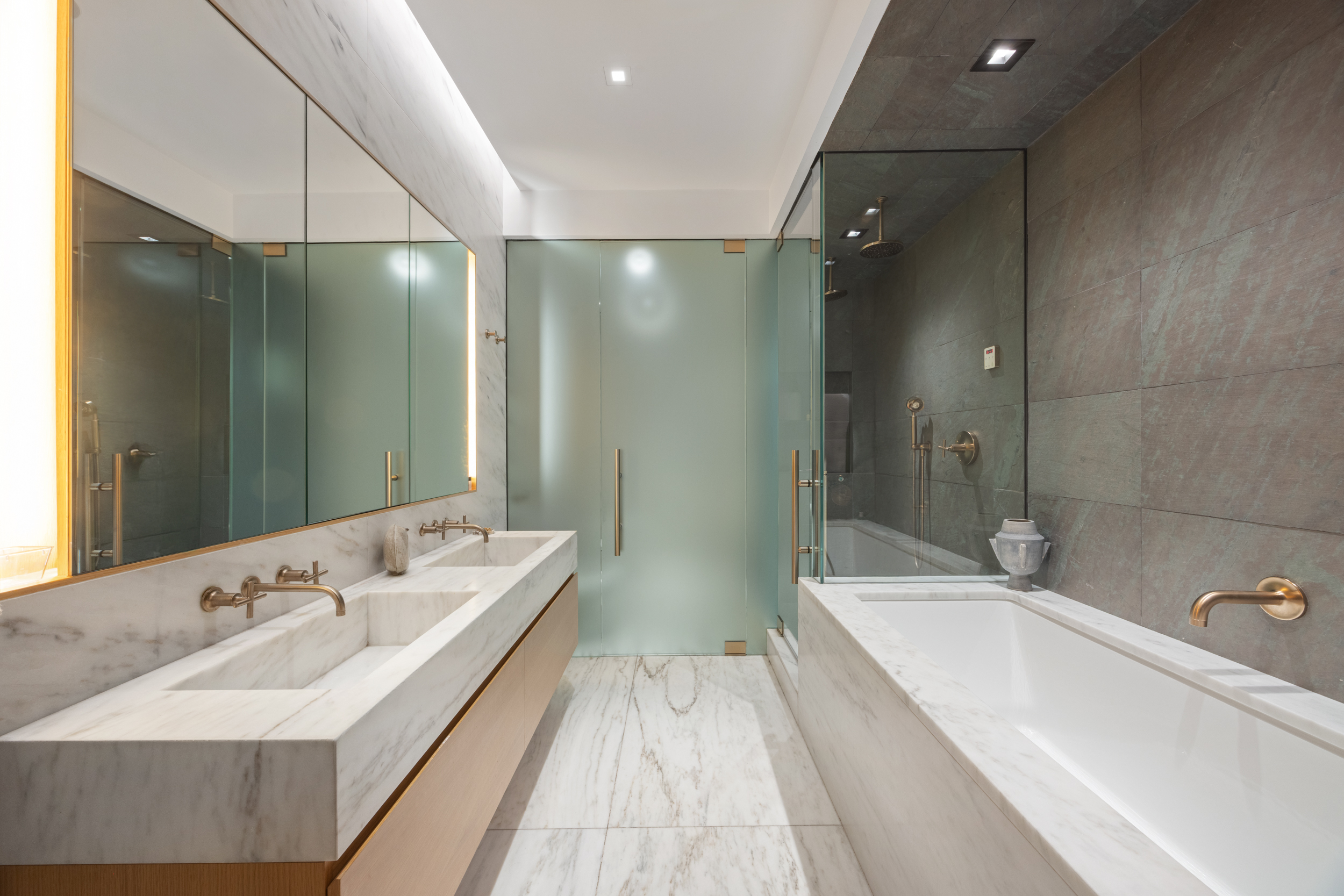 60 White Street, Unit 4E Manhattan, NY 10013 - Photo 13 of 19 a bathroom with a tub sink and mirror