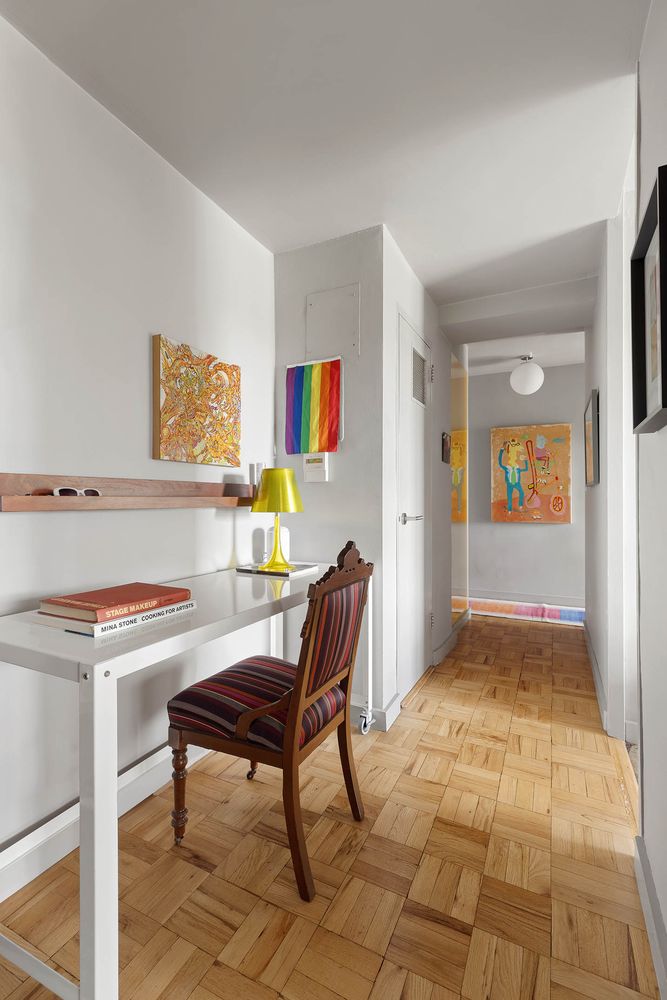 a workspace with furniture and window