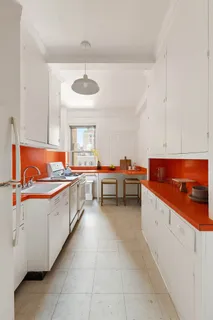 a kitchen with stainless steel appliances a sink and a stove