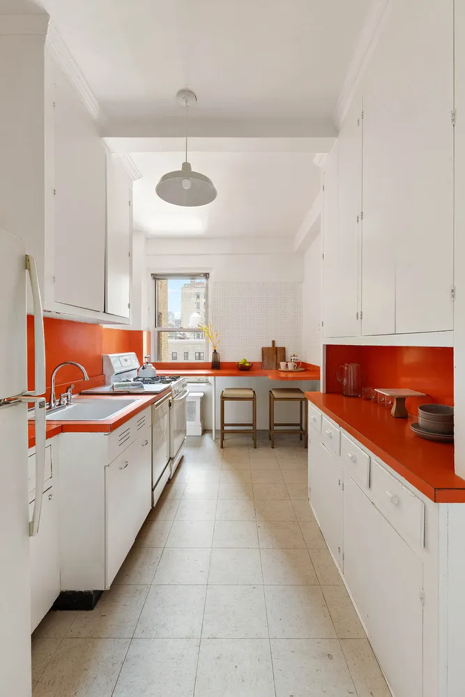 a kitchen with stainless steel appliances a sink and a stove