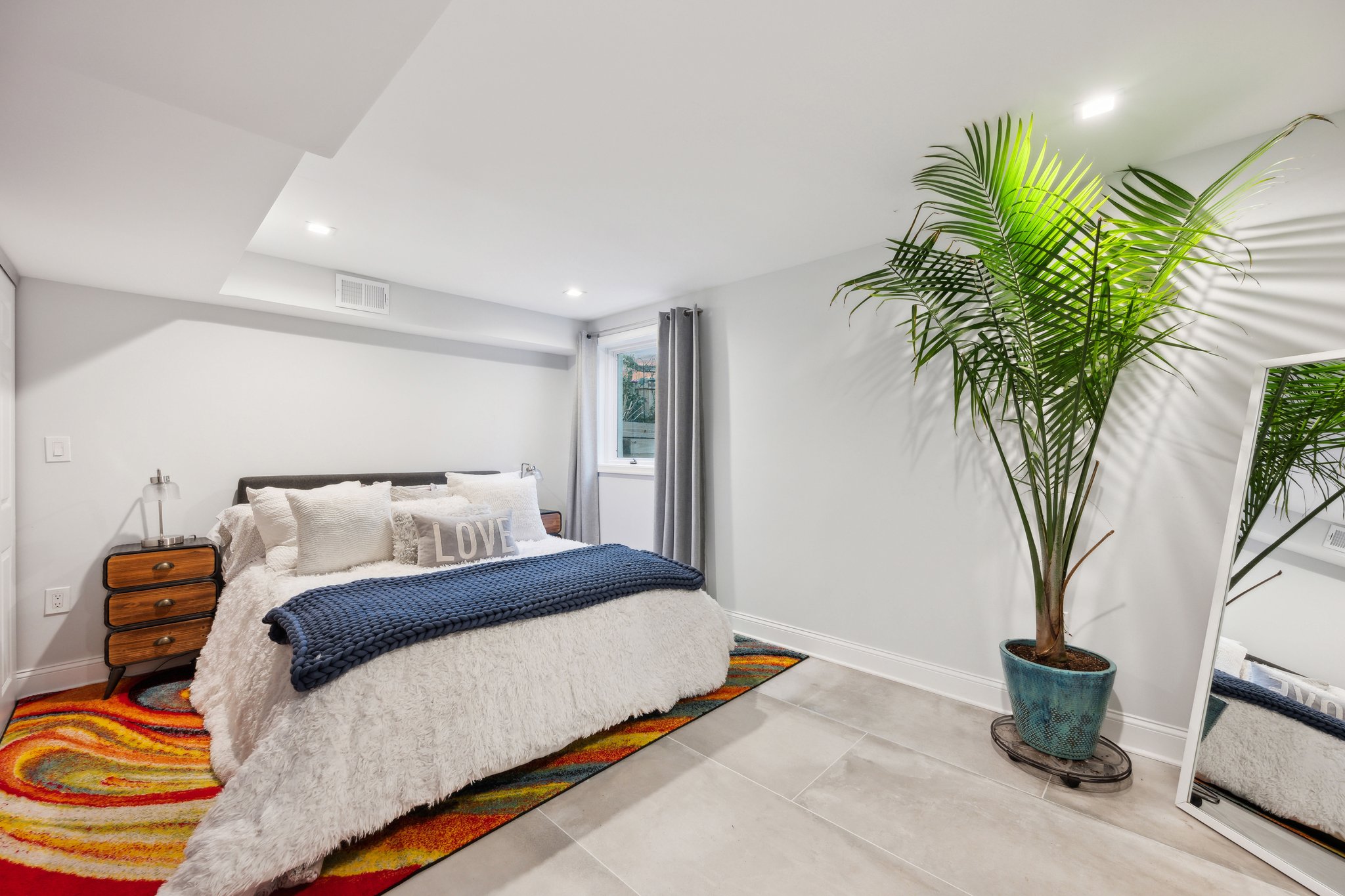 2607 Ross Road Chevy Chase, MD 20815 - Photo 27 of 37 a bedroom with a large bed and a potted plant