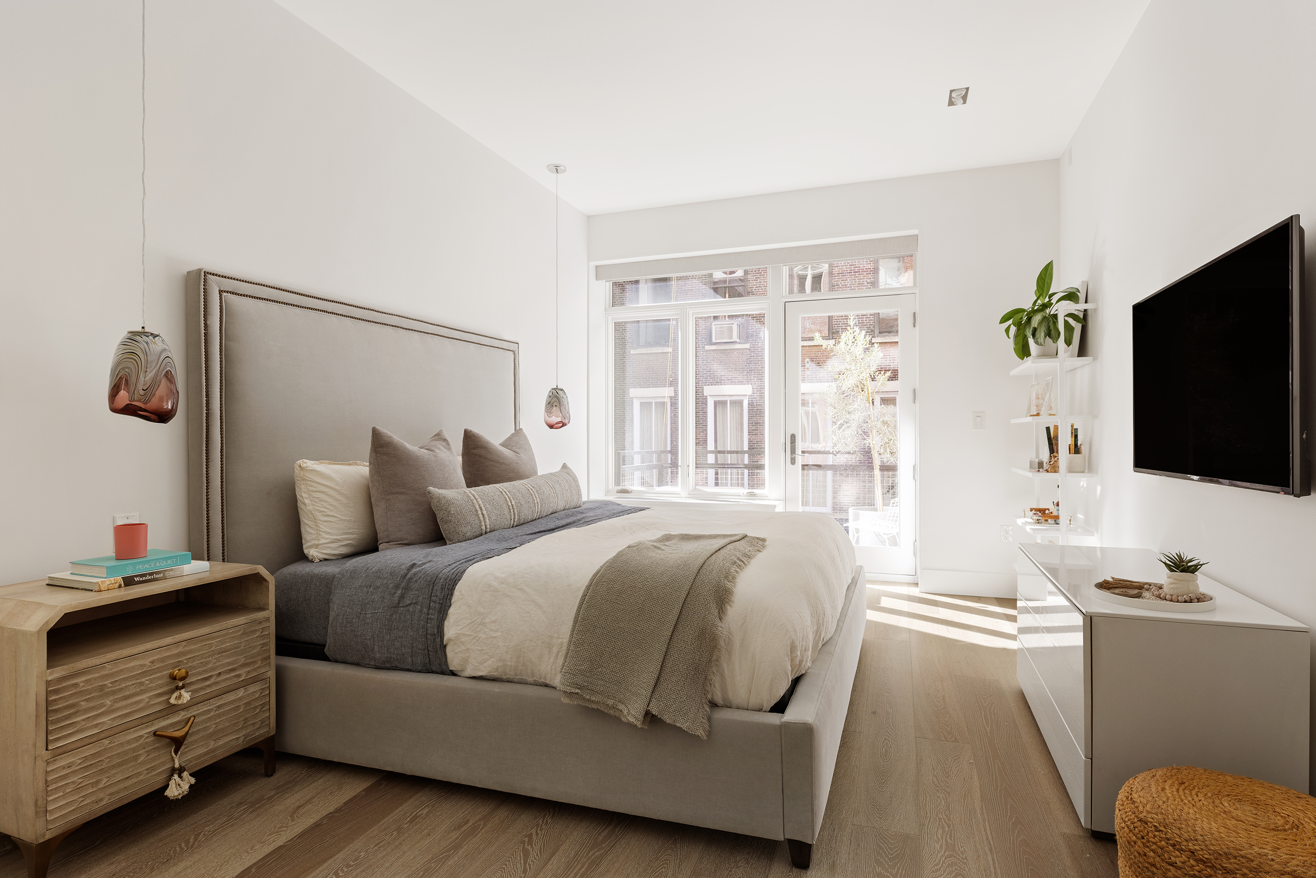 51 Walker Street, Unit 4B Manhattan, NY 10013 - Photo 5 of 13 a bedroom with a bed and a flat screen tv