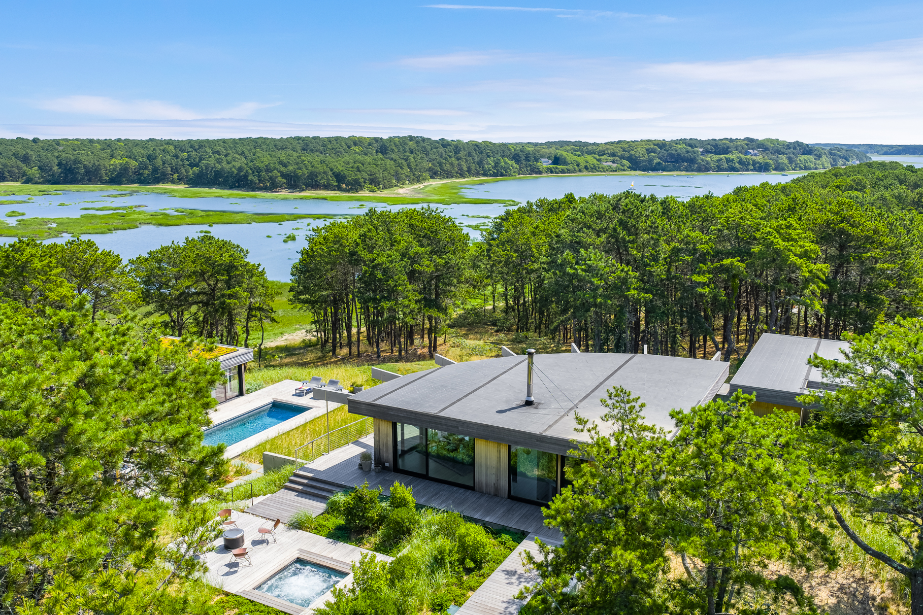 a view of a swimming pool with a patio and a yard