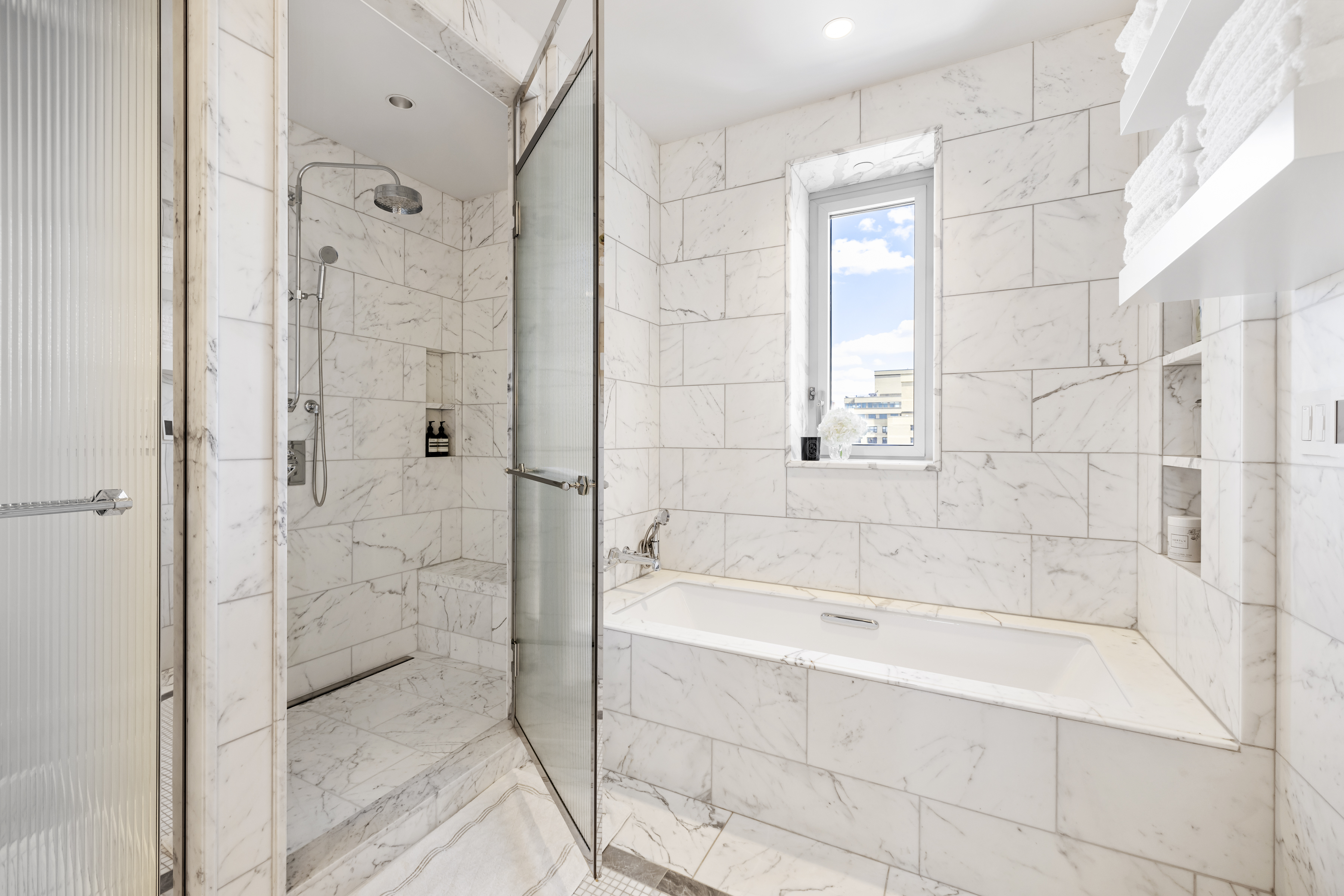 301 East 80th Street, Unit 25B Manhattan, NY 10075 - Photo 18 of 38 a bathroom with a bathtub and a shower
