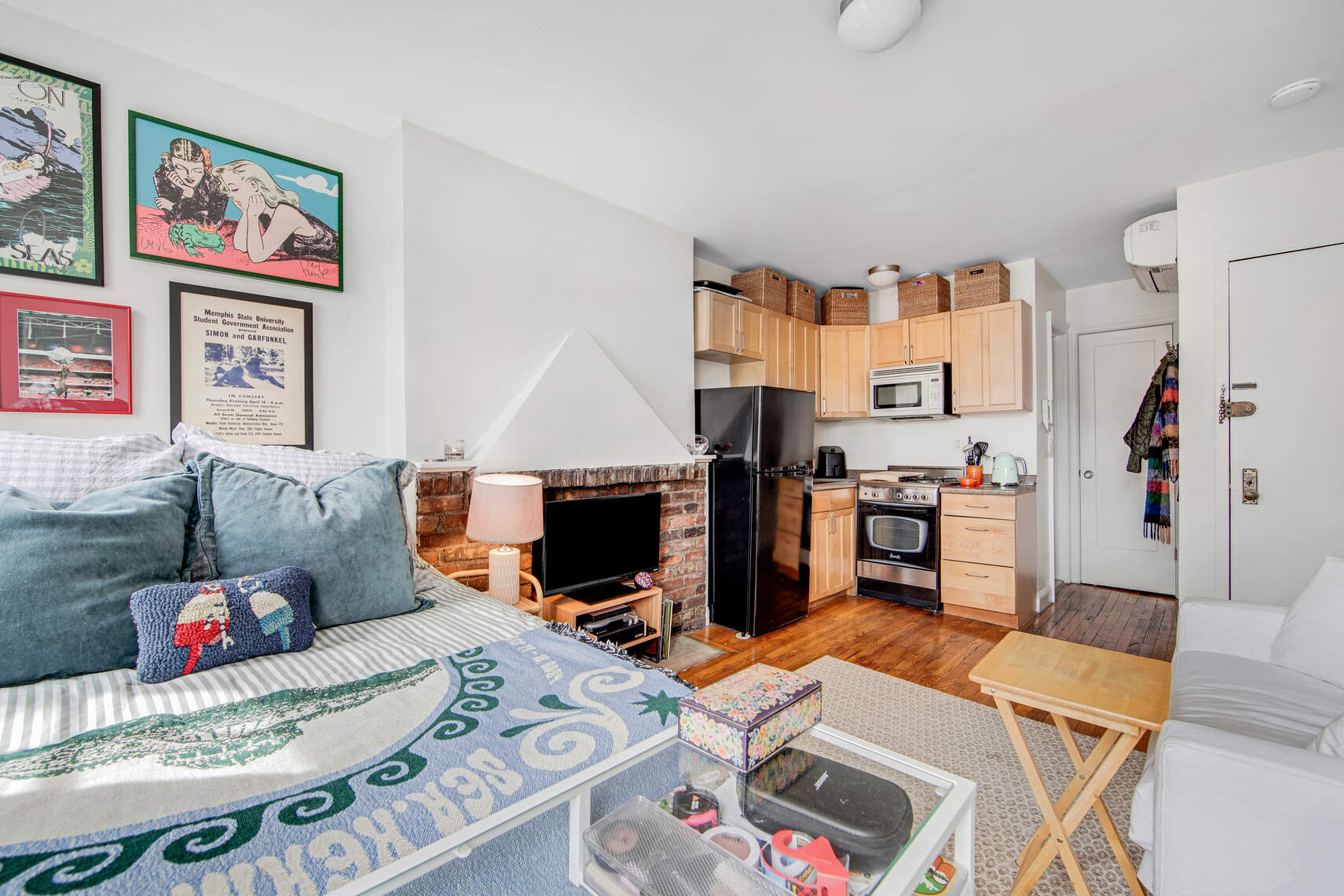 352 West 12th Street, Unit 5D Manhattan, NY 10014 - Photo 6 of 11 a living room with furniture and a flat screen tv