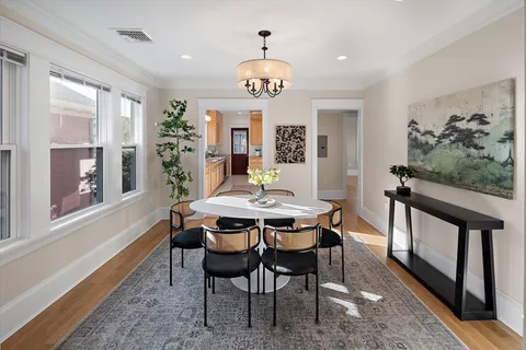 a view of a dining room with furniture window and outside view