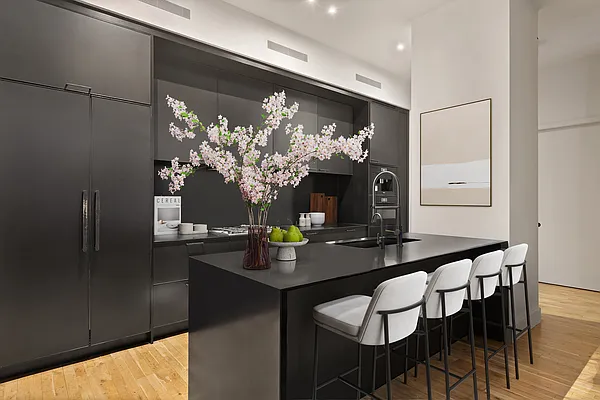 360 Furman Street, Unit 322/323 Brooklyn, NY 11201 - Photo 9 of 42 a kitchen with a table and chairs in it