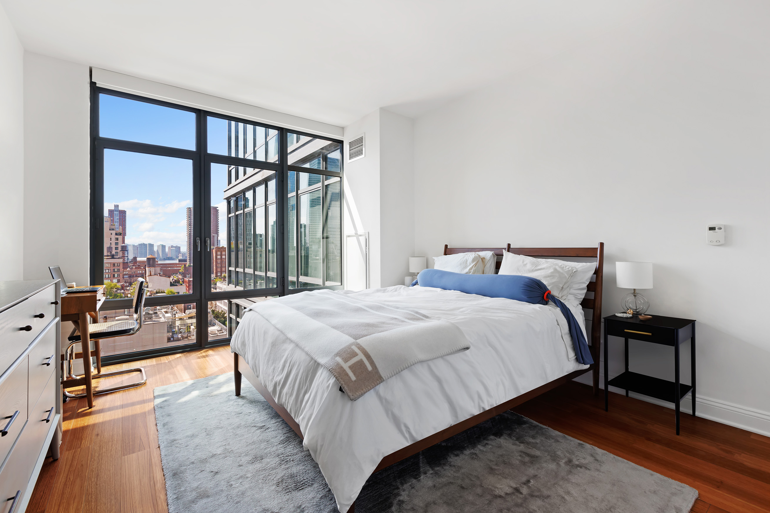 57 Reade Street, Unit 14C Manhattan, NY 10007 - Photo 8 of 16 a bedroom with a bed and a large window