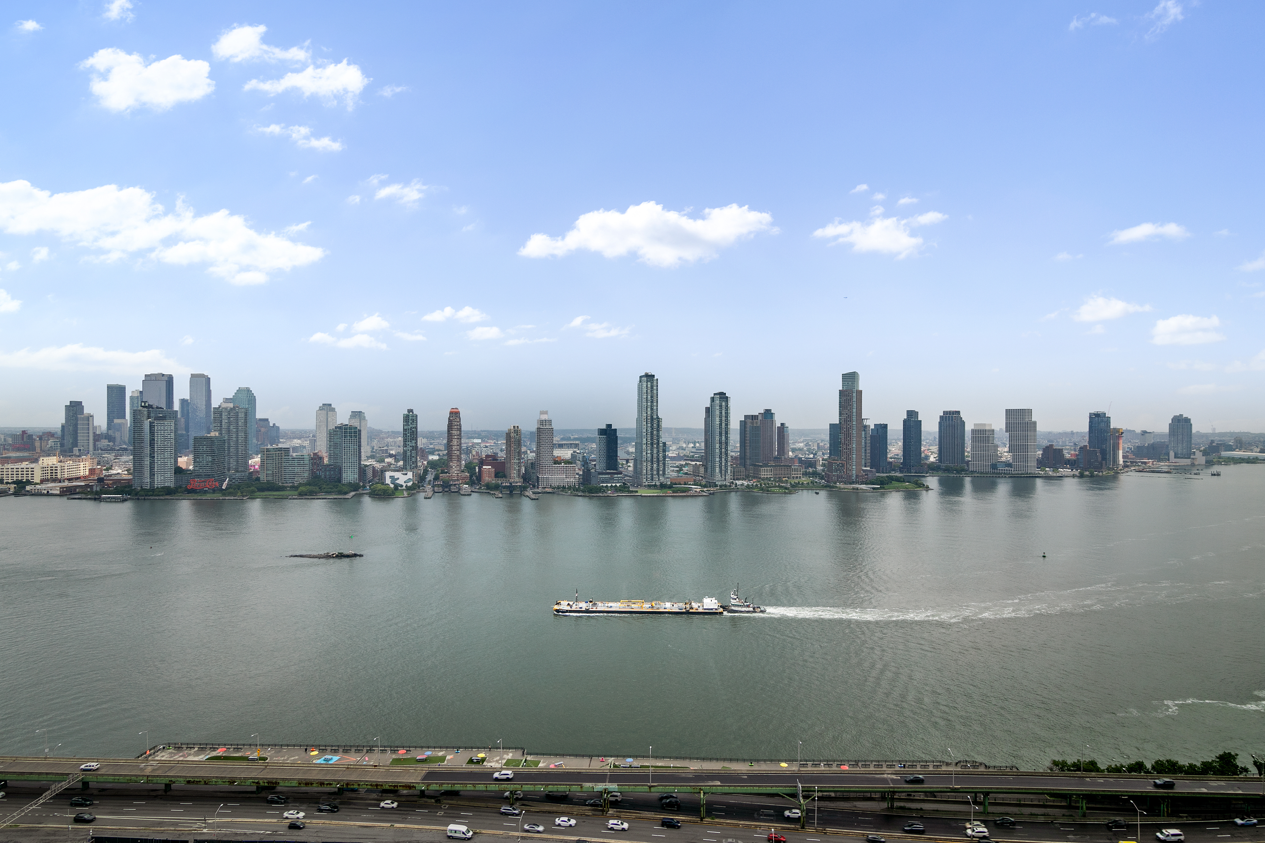 695 1st Avenue, Unit 31C Manhattan, NY 10016 - Photo 2 of 27 a view of a lake with a large building